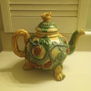 Ceramic floral wrapped with bird topper footed vintage teapot